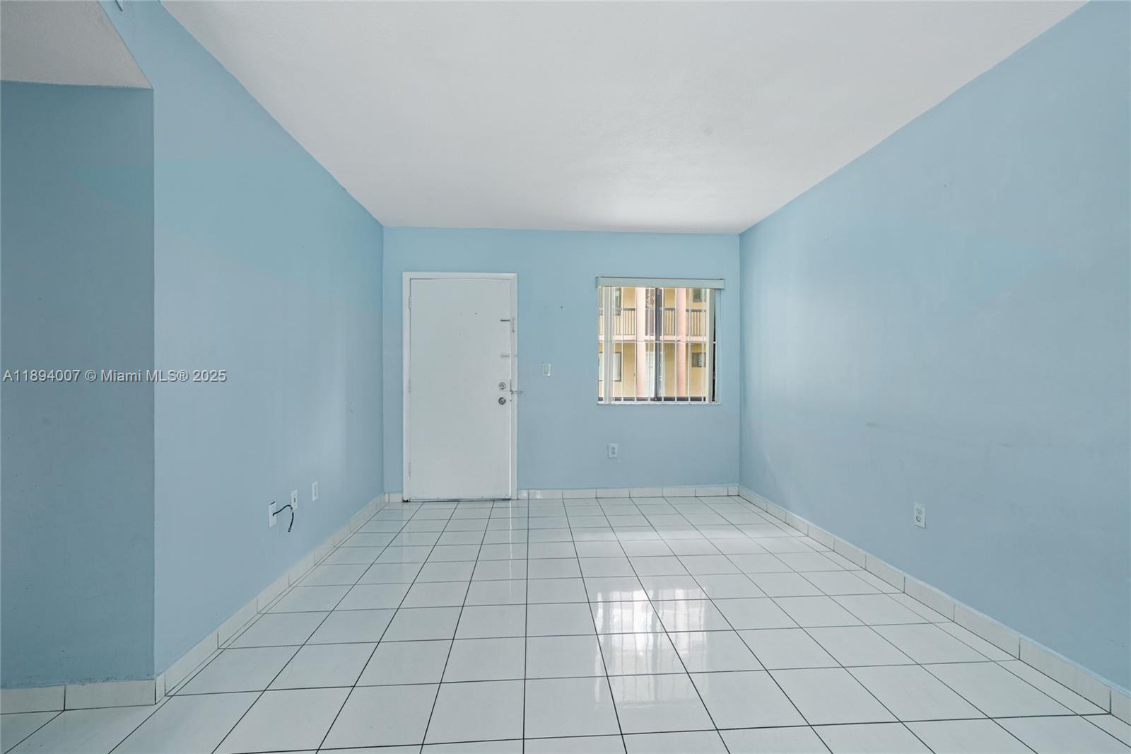 5490 West 21st Court, Unit 112 Hialeah, FL 33016 - Photo 17 of 43 an empty room with windows