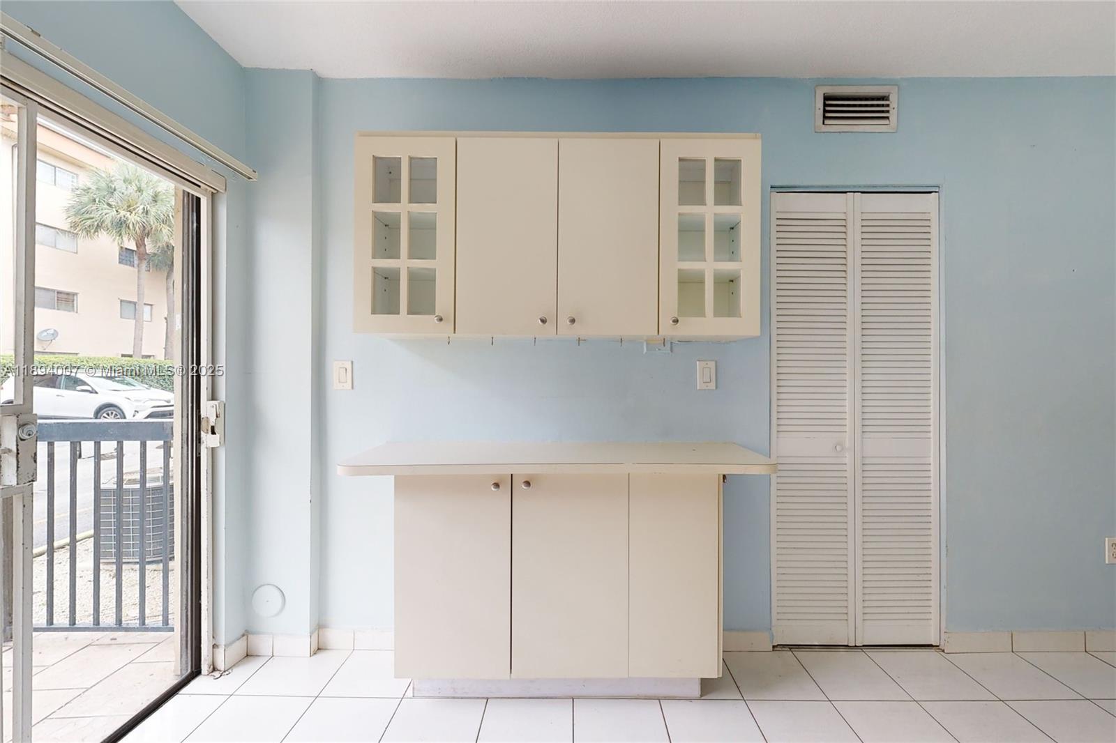 5490 West 21st Court, Unit 112 Hialeah, FL 33016 - Photo 22 of 43 a view of kitchen with furniture and window