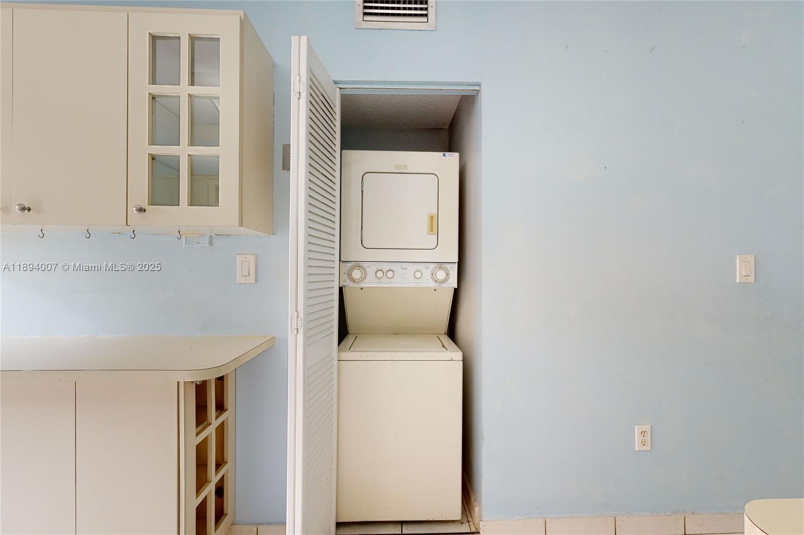 5490 West 21st Court, Unit 112 Hialeah, FL 33016 - Photo 24 of 43 a utility room with dryer and washer