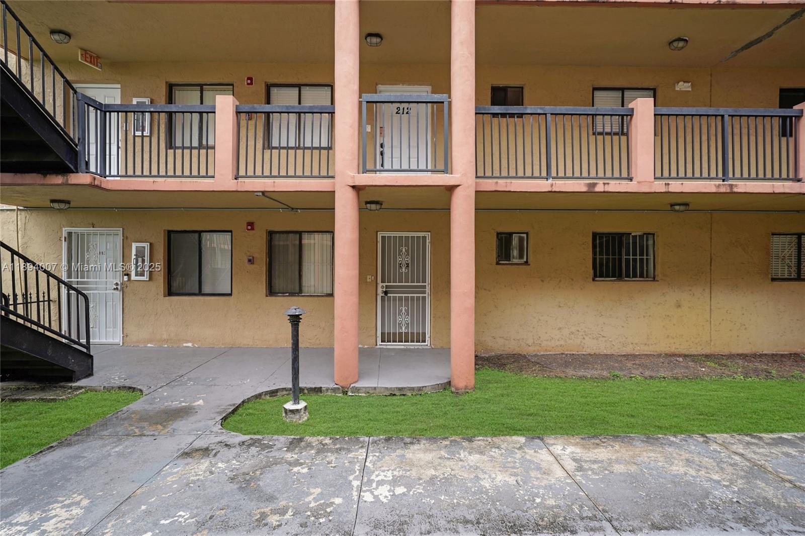 5490 West 21st Court, Unit 112 Hialeah, FL 33016 - Photo 35 of 43 a front view of a house with garden