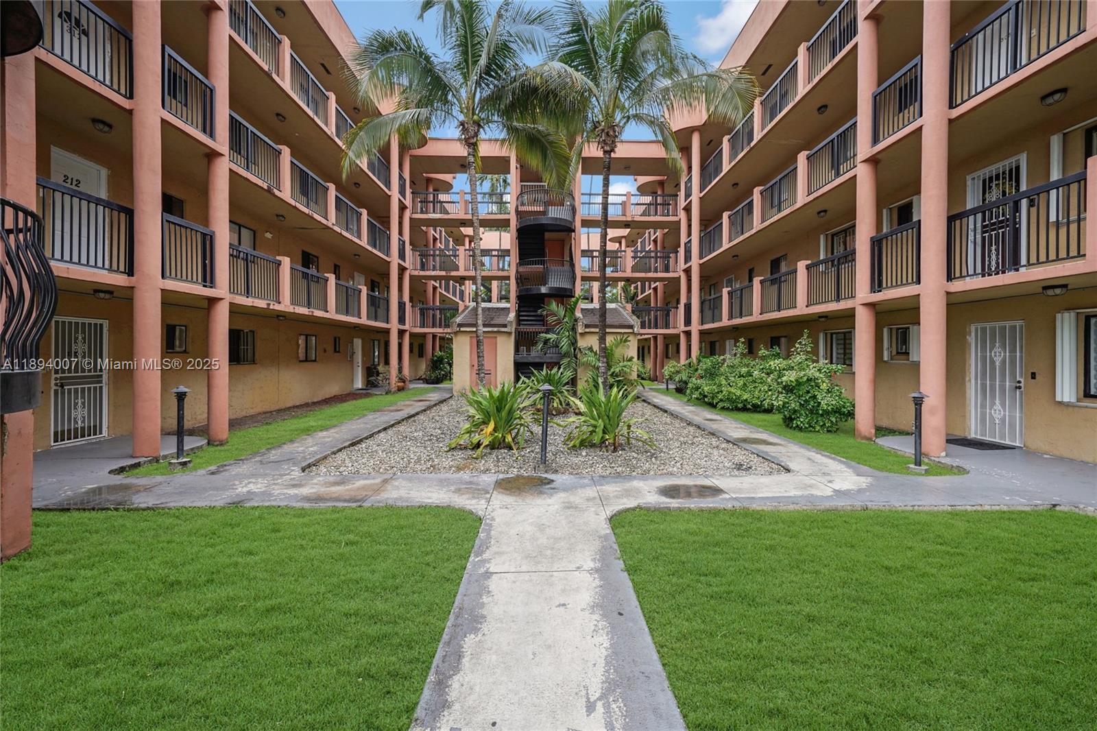 5490 West 21st Court, Unit 112 Hialeah, FL 33016 - Photo 37 of 43 a view of a building with a yard