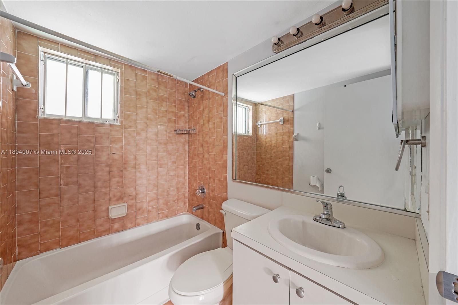 5490 West 21st Court, Unit 112 Hialeah, FL 33016 - Photo 40 of 43 a bathroom with a sink toilet and shower