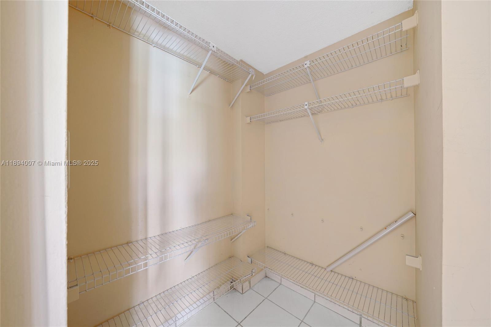 5490 West 21st Court, Unit 112 Hialeah, FL 33016 - Photo 7 of 43 a view of an empty walk in closet