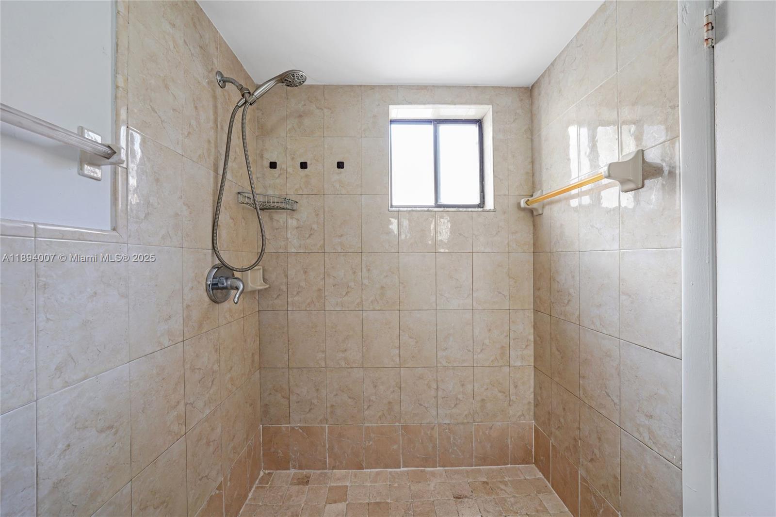 5490 West 21st Court, Unit 112 Hialeah, FL 33016 - Photo 9 of 43 a bathroom with a shower