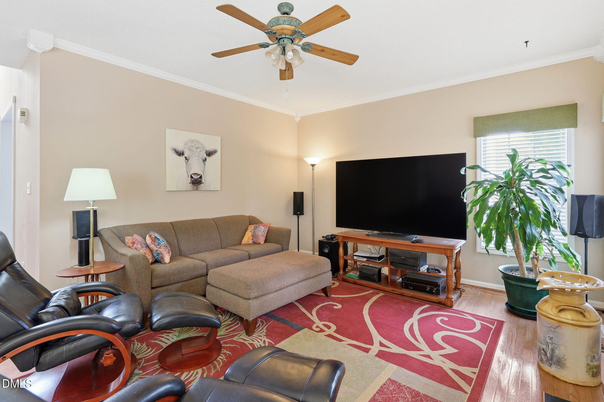 9105 Willow Valley Court Raleigh, NC 27617 - Photo 12 of 51 a living room with furniture and a flat screen tv