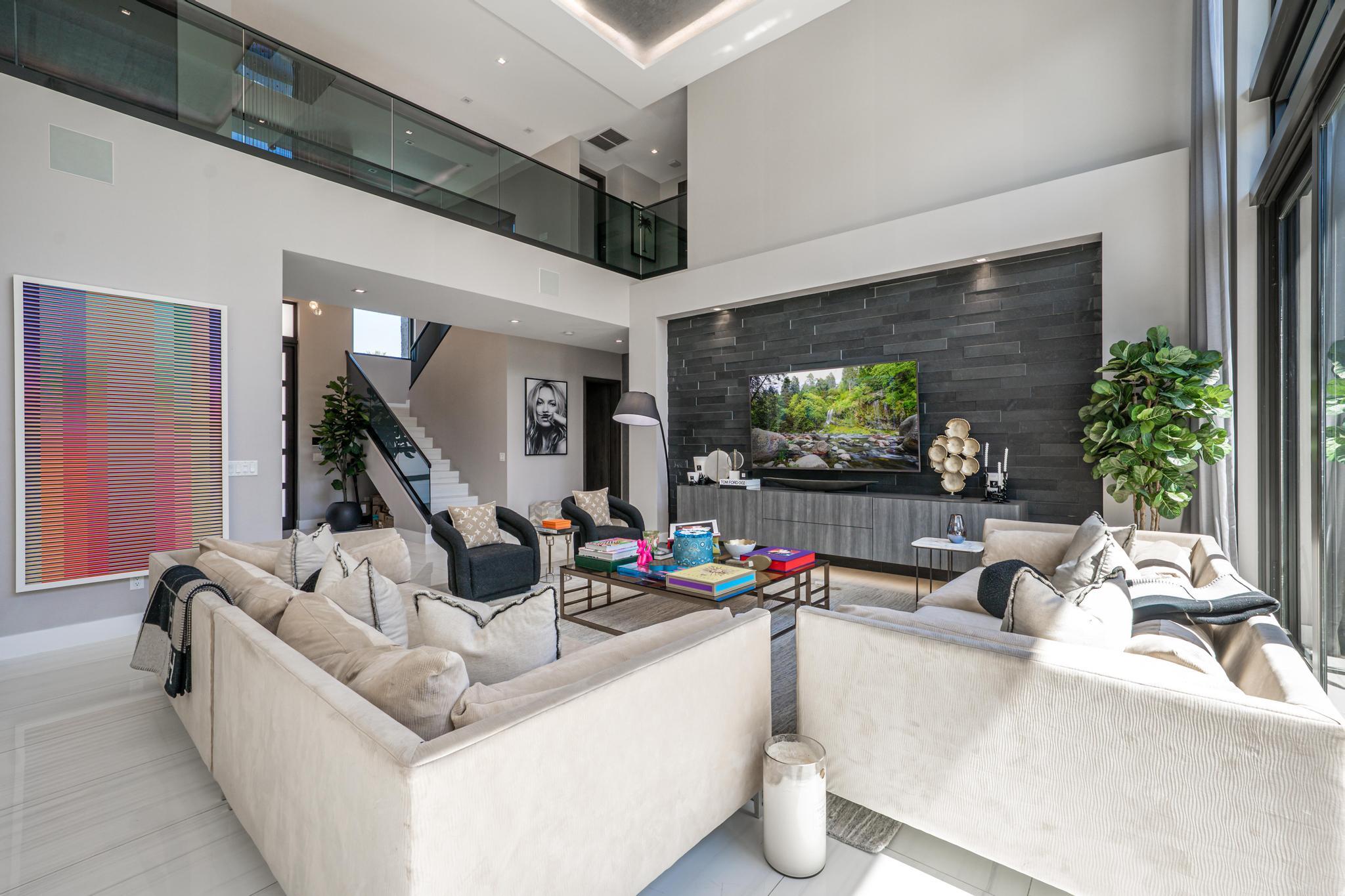 520 Northeast 4th Lane Boca Raton, FL 33432 - Photo 9 of 40 a living room with furniture and a flat screen tv