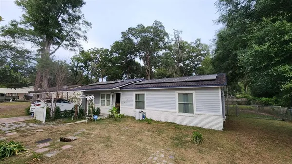 a house with trees in the background