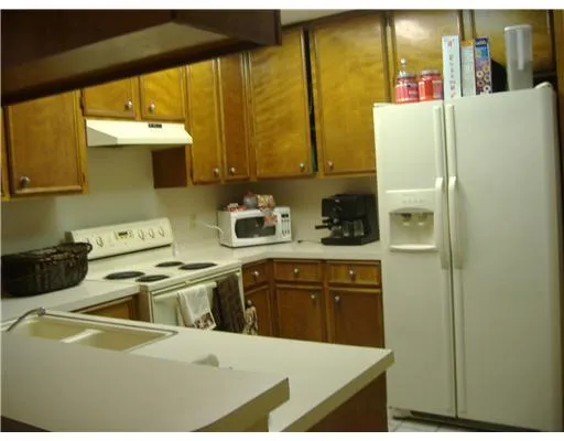 a kitchen that has a sink and a stove