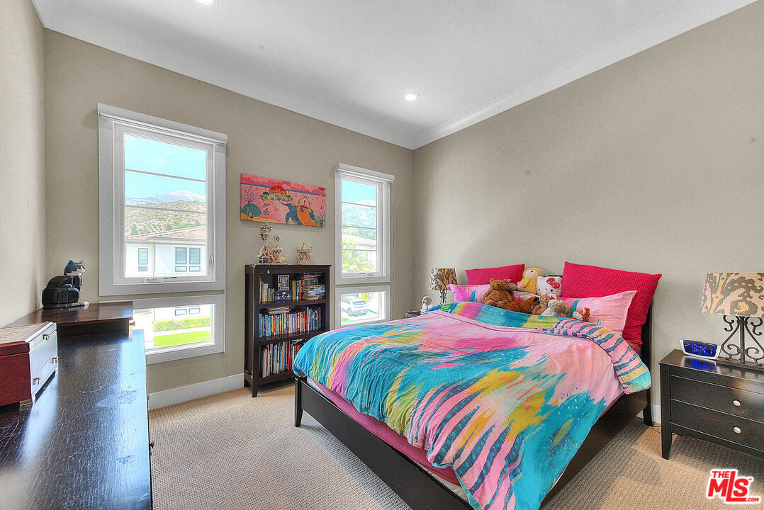 20558 Overlook Court Porter Ranch, CA 91326 - Photo 30 of 48 a bedroom with a bed and wooden floor