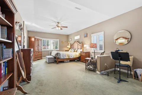 a bedroom with furniture and a chandelier