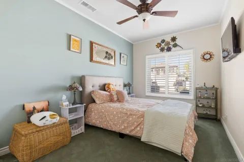 a bedroom with bed and window