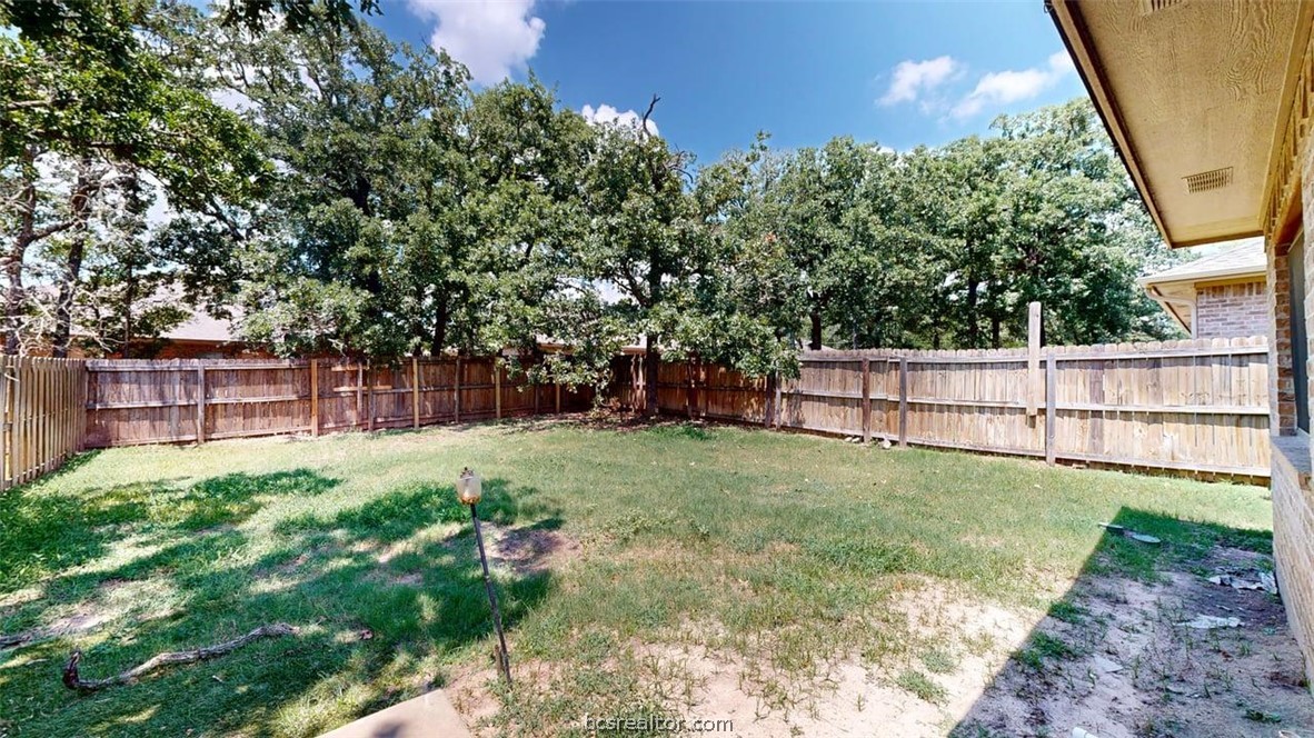 4453-4455 Reveille Road College Station, TX 77845 - Photo 37 of 37 a backyard of a house with lots of green space