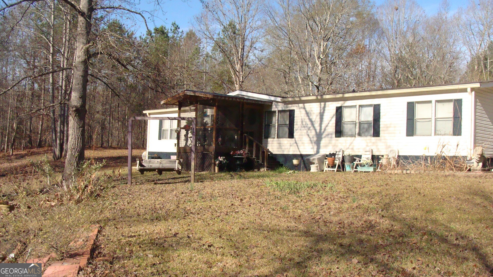 758 Mahaley Road Franklin, GA 30217 - Photo 4 of 12 a view of a house with a yard and sitting area