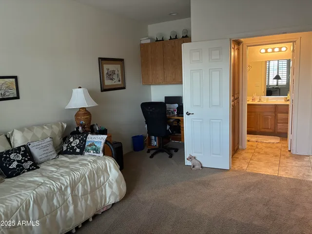 a bedroom with bed and a window