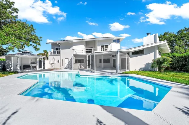 a kitchen with cabinets and stainless steel appliances
