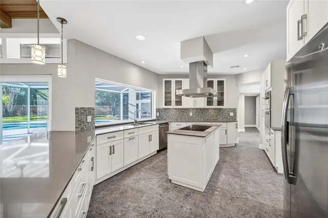 a spacious bathroom with a granite countertop sink and a mirror