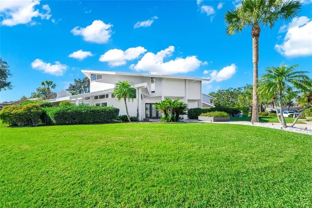 an aerial view of a house with a garden