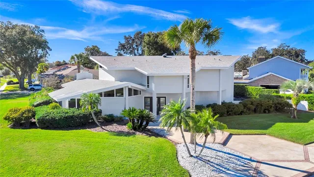 a view of a swimming pool with a yard