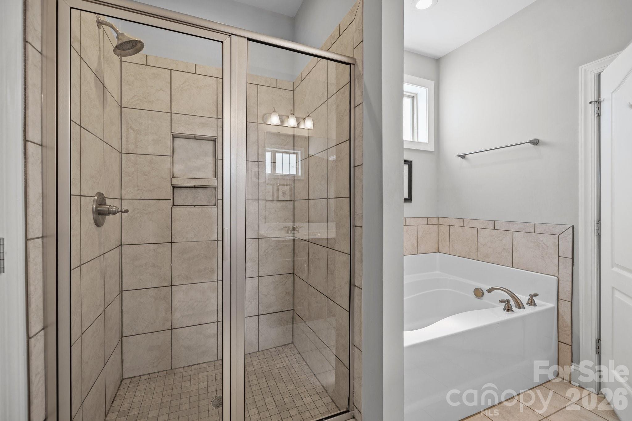 4697 Rinaldo Road York, SC 29745 - Photo 16 of 37 a bathroom with a bathtub and shower