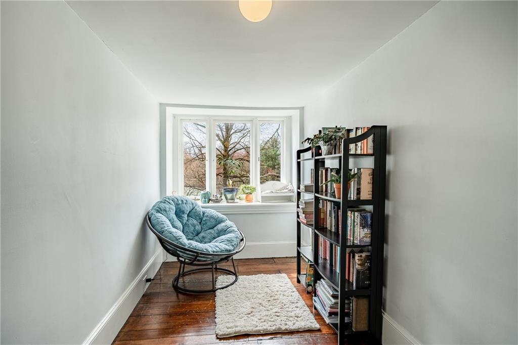 701 Oakbourne Road West Chester, PA 19382 - Photo 31 of 50 a living room with fish tank and a bookshelf