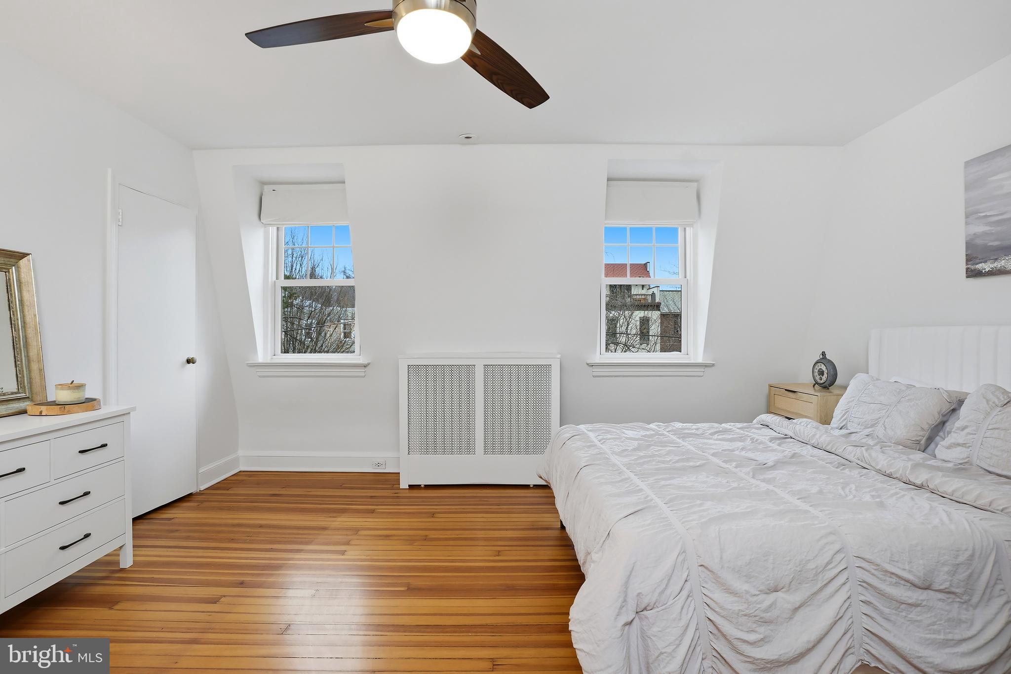 3520 S Street Northwest Washington, DC 20007 - Photo 16 of 44 a bedroom with a bed and a chandelier