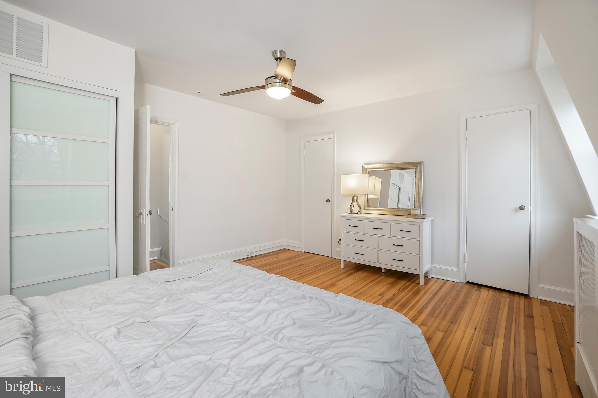 3520 S Street Northwest Washington, DC 20007 - Photo 17 of 44 a bedroom with a bed and a chandelier
