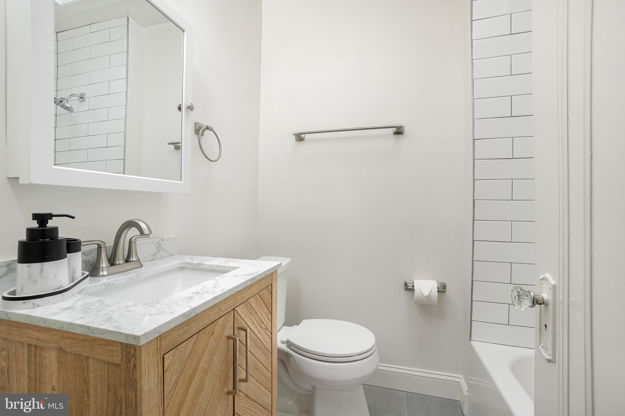 3520 S Street Northwest Washington, DC 20007 - Photo 18 of 44 a bathroom with a sink toilet and vanity