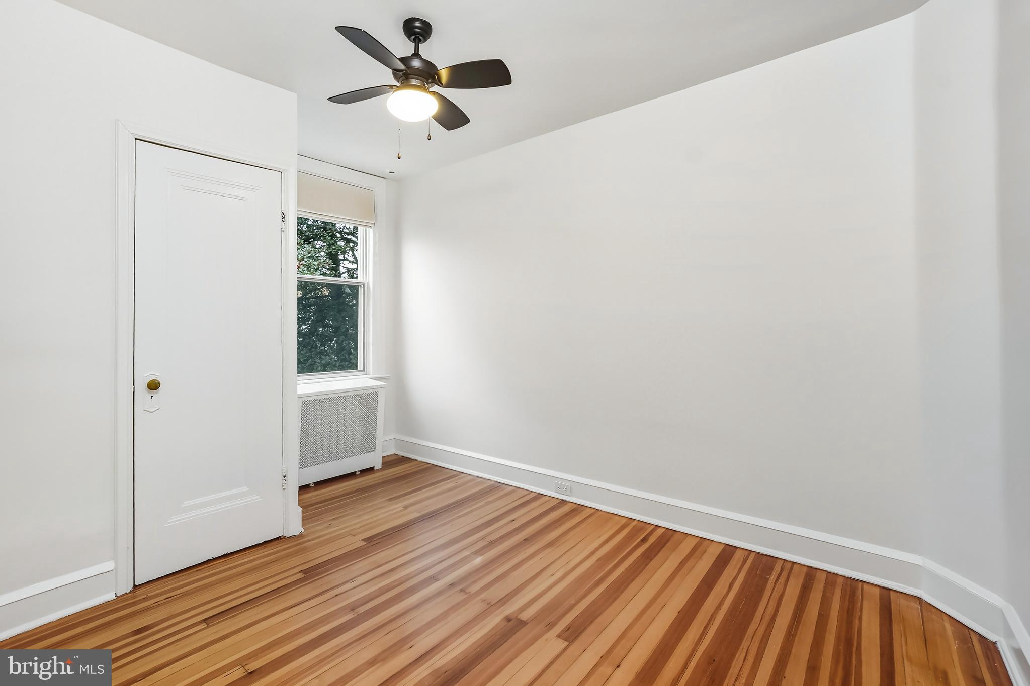 3520 S Street Northwest Washington, DC 20007 - Photo 19 of 44 a view of room with hardwood floor and a ceiling fan