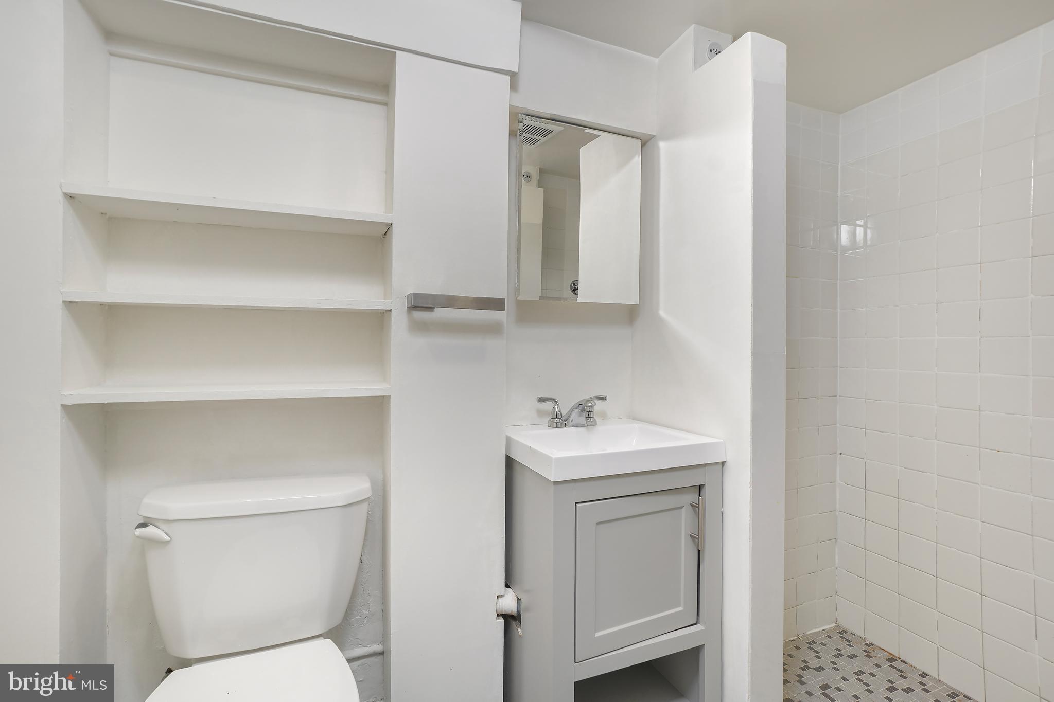 3520 S Street Northwest Washington, DC 20007 - Photo 25 of 44 a bathroom with a toilet sink and mirror