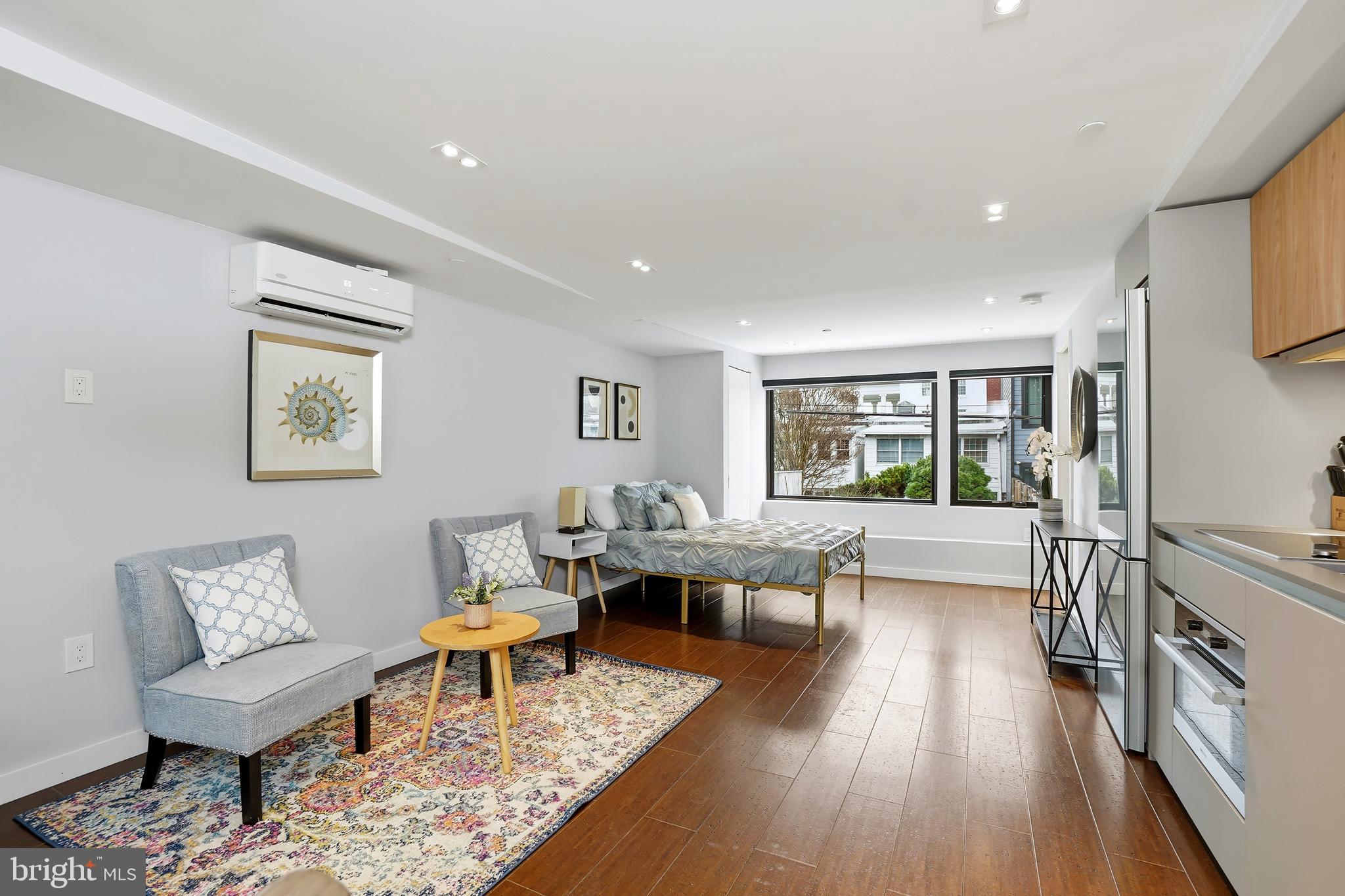 3520 S Street Northwest Washington, DC 20007 - Photo 27 of 44 a living room with furniture and a wooden floor