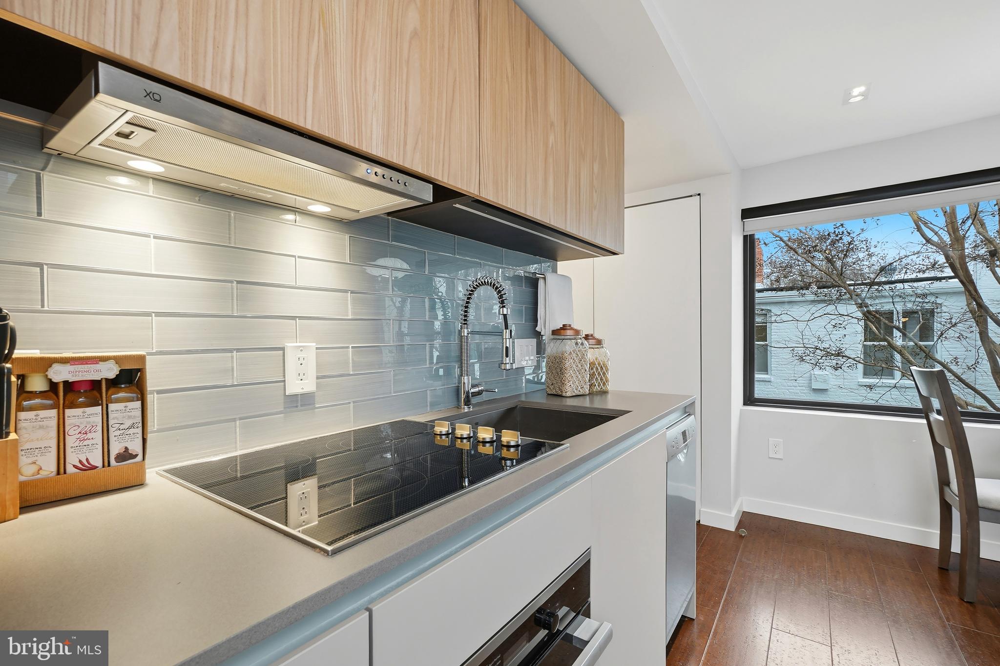 3520 S Street Northwest Washington, DC 20007 - Photo 29 of 44 a kitchen with a sink and a stove top oven