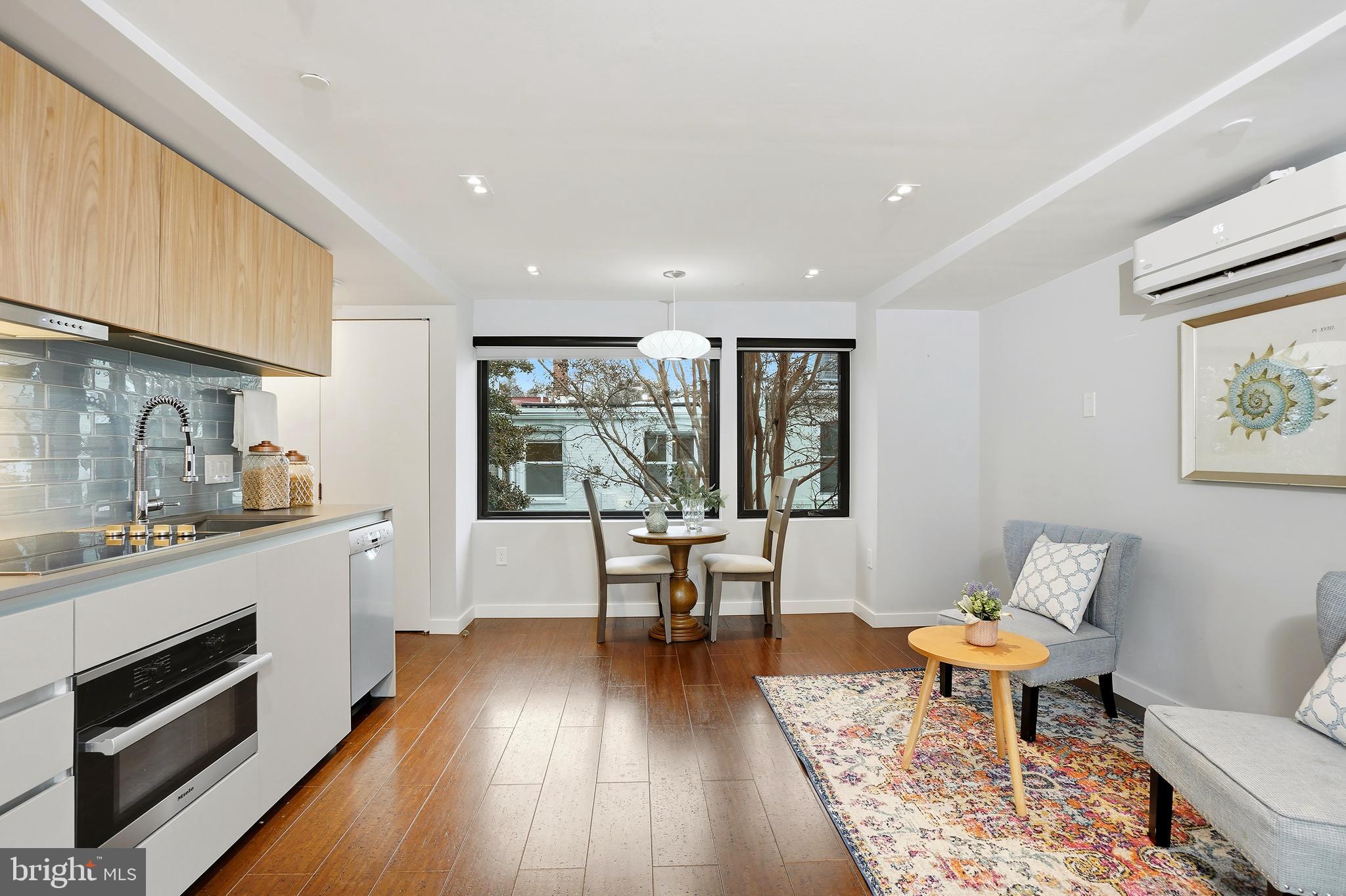 3520 S Street Northwest Washington, DC 20007 - Photo 30 of 44 a living room with furniture and a fireplace