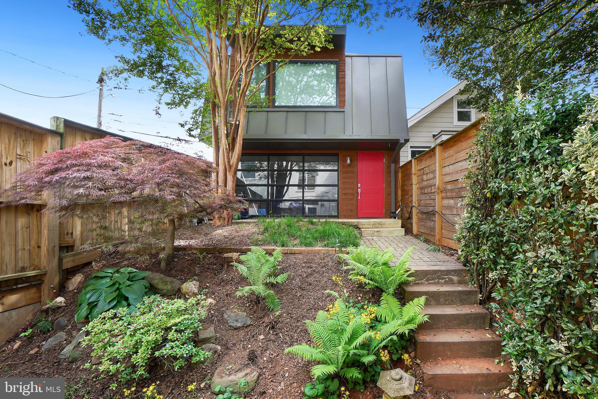3520 S Street Northwest Washington, DC 20007 - Photo 3 of 11 a front view of a house with a yard and potted plants