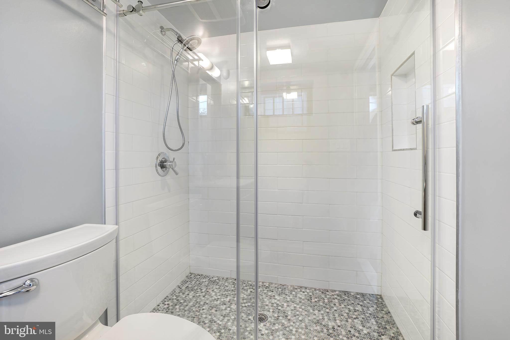 3520 S Street Northwest Washington, DC 20007 - Photo 35 of 44 a bathroom with a shower a toilet and a sink