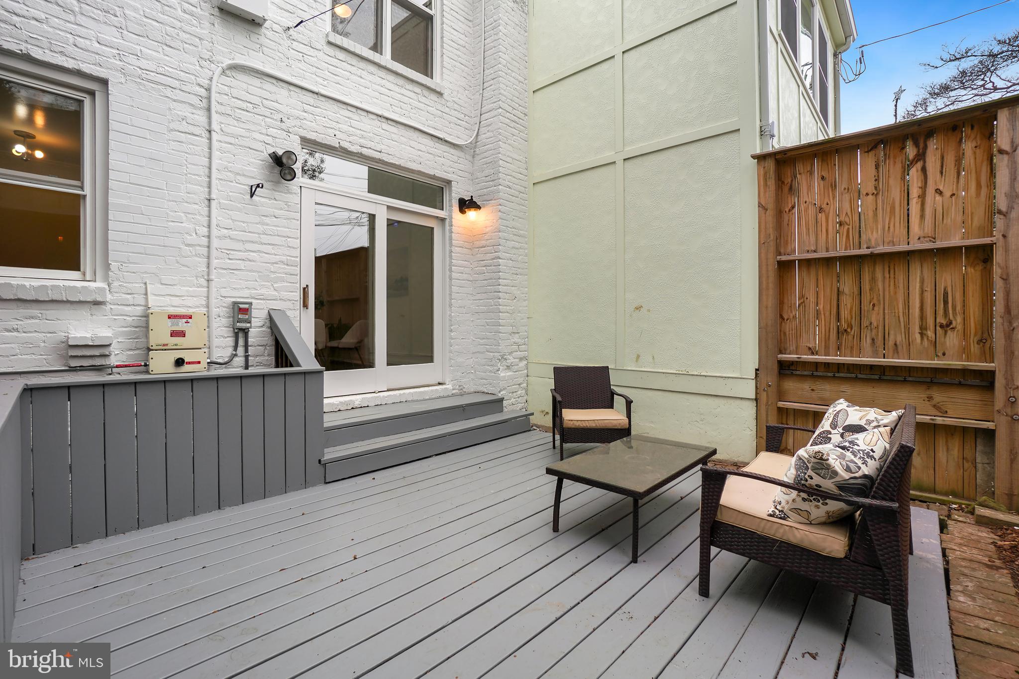 3520 S Street Northwest Washington, DC 20007 - Photo 39 of 44 a view of a wooden deck with furniture