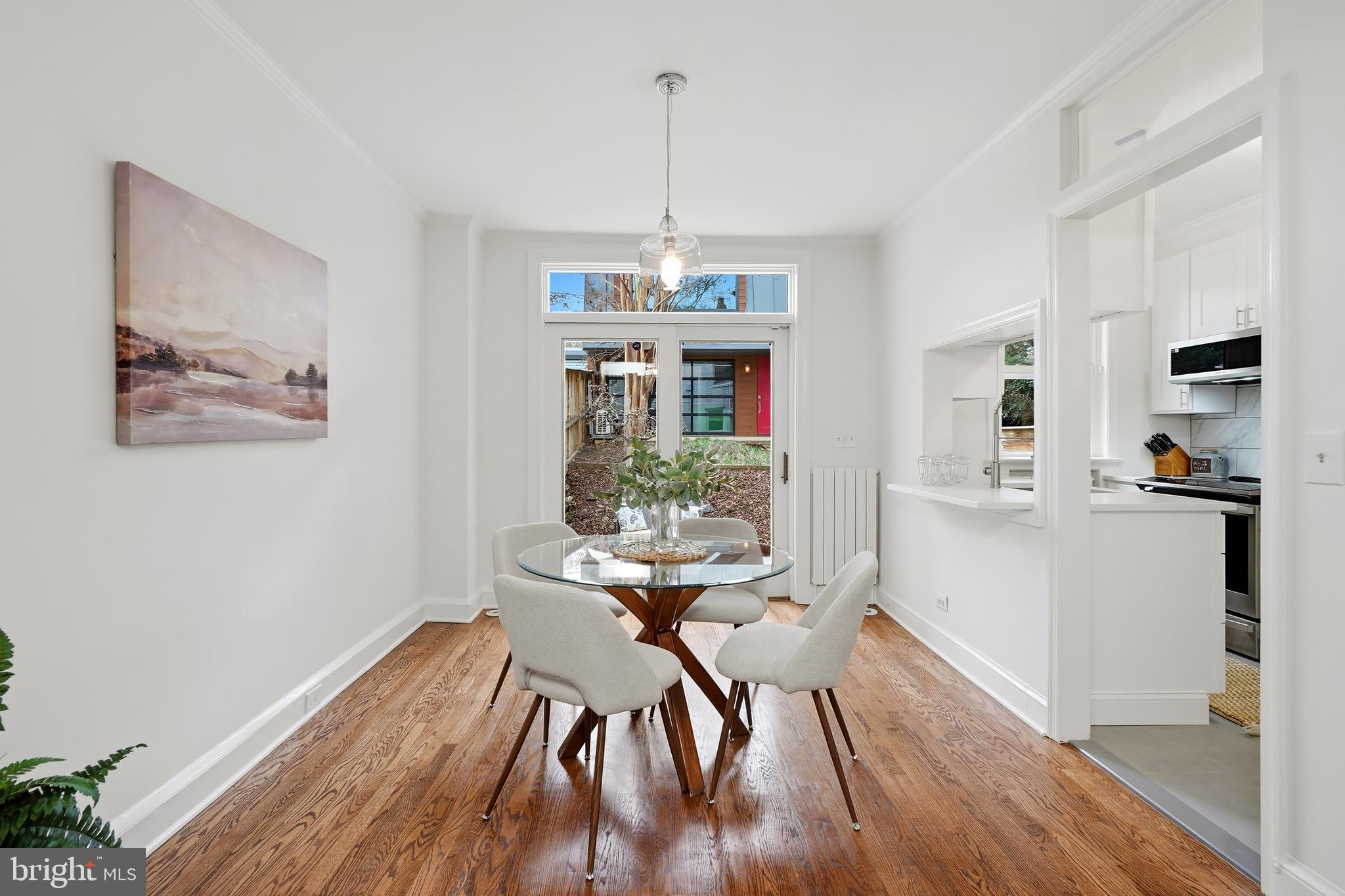 3520 S Street Northwest Washington, DC 20007 - Photo 6 of 44 a view of a dining room with furniture window and wooden floor
