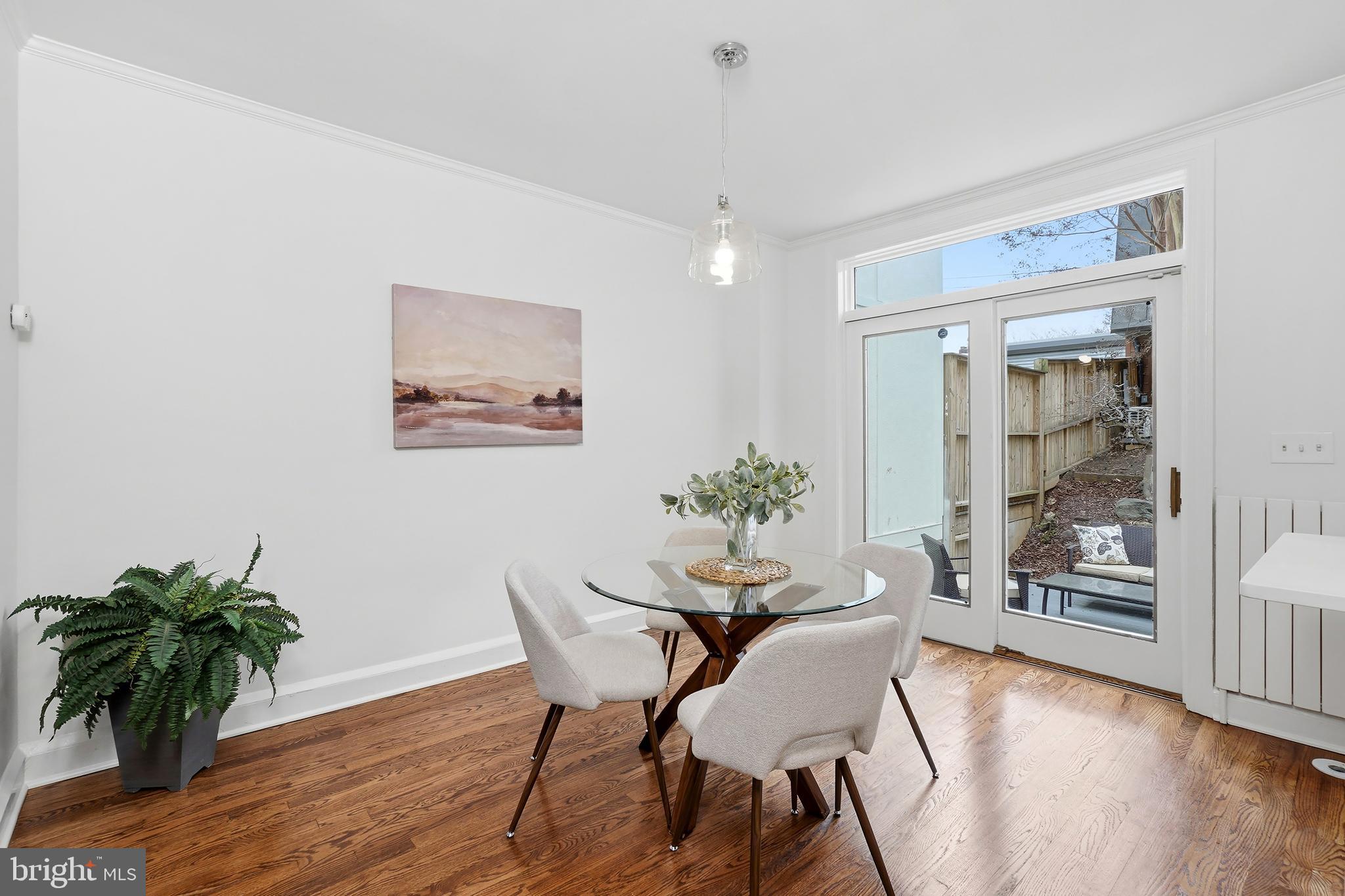 3520 S Street Northwest Washington, DC 20007 - Photo 7 of 44 a dining room with furniture and wooden floor