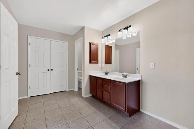 a bathroom with a shower and a sink