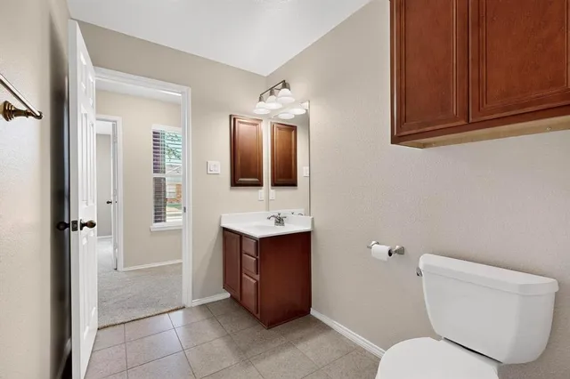 a spacious bathroom with a double vanity sink mirror and double