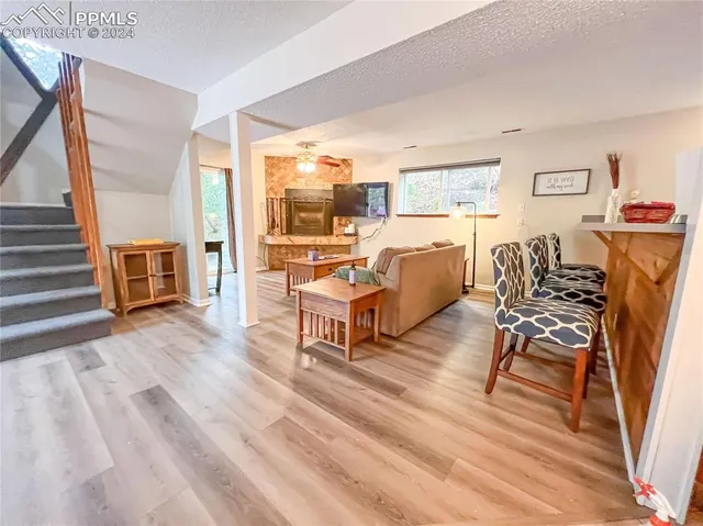 a living room with a couch next to a window