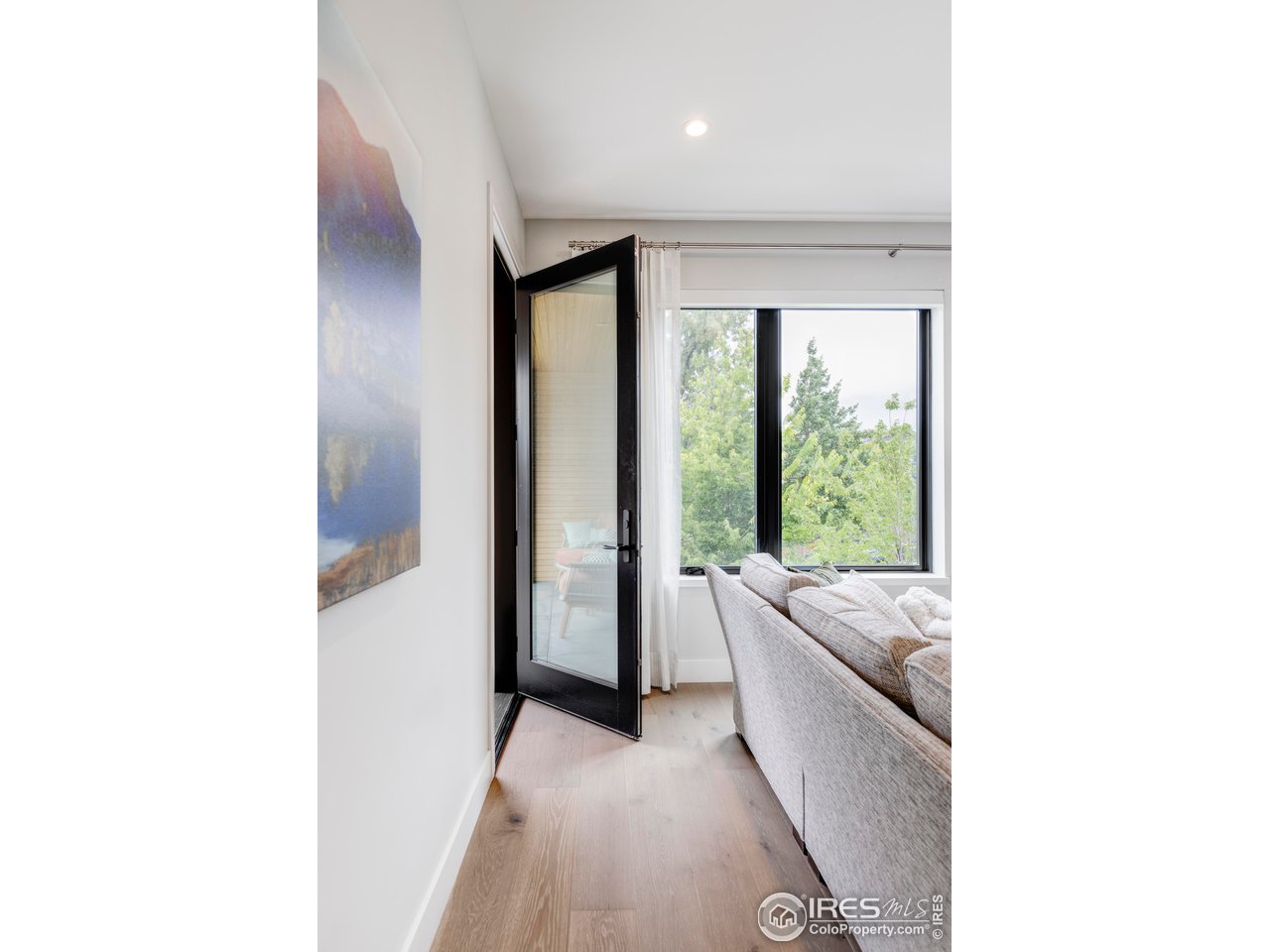 2718 Pine Street, Unit 202 Boulder, CO 80302 - Photo 13 of 33 Living room door to balcony