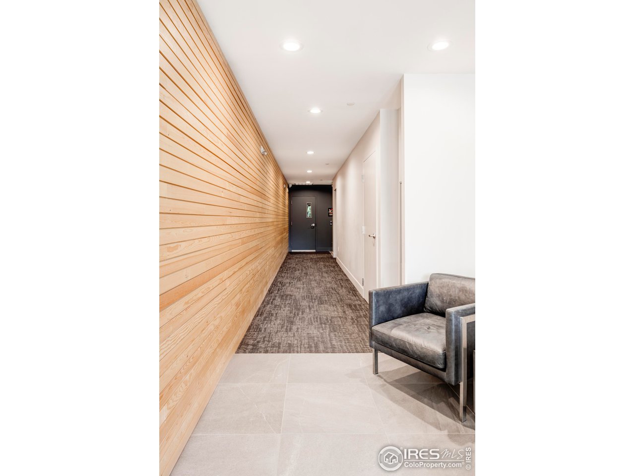 2718 Pine Street, Unit 202 Boulder, CO 80302 - Photo 3 of 33 Main hallway, leading to elevator, stairs, parking garage + storage