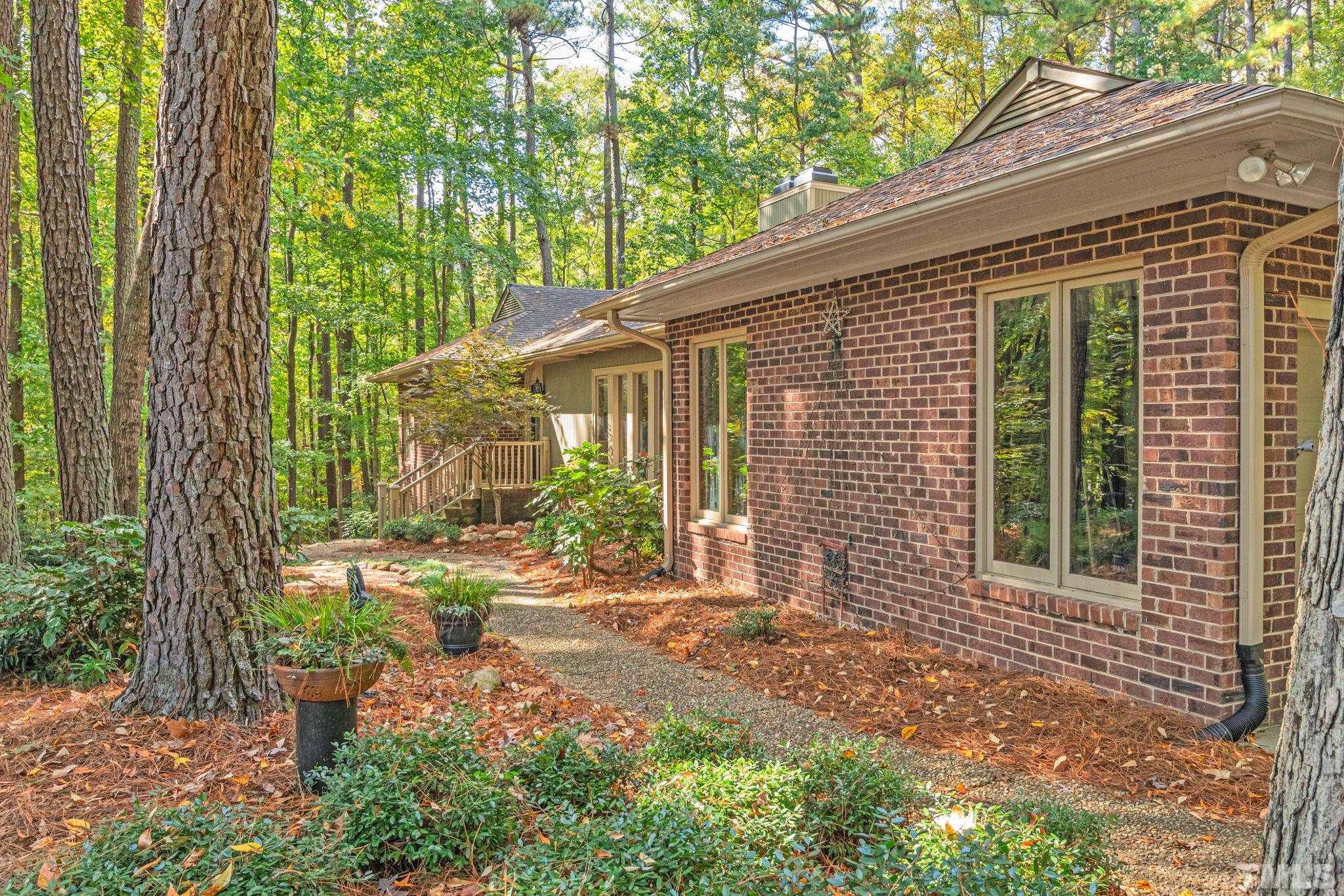 10229 Boxelder Drive Raleigh, NC 27613 - Photo 2 of 52 a front view of a house with garden