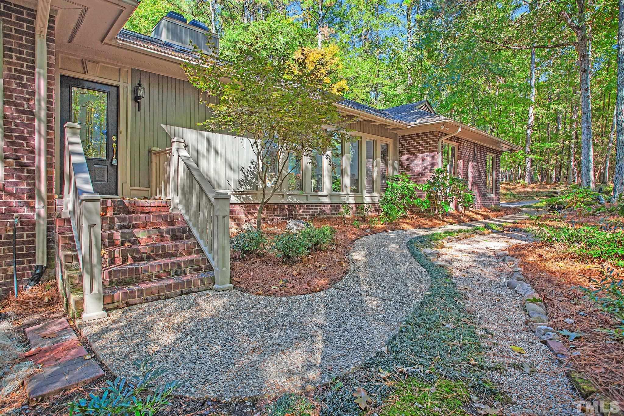 10229 Boxelder Drive Raleigh, NC 27613 - Photo 52 of 52 a front view of a house with a yard