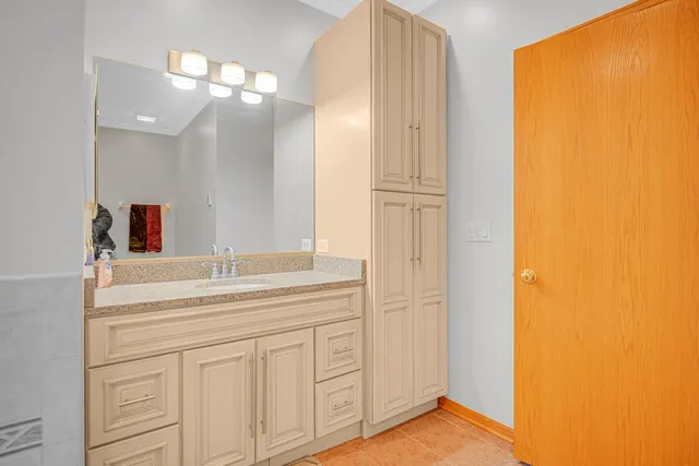 a bathroom with a sink and a mirror