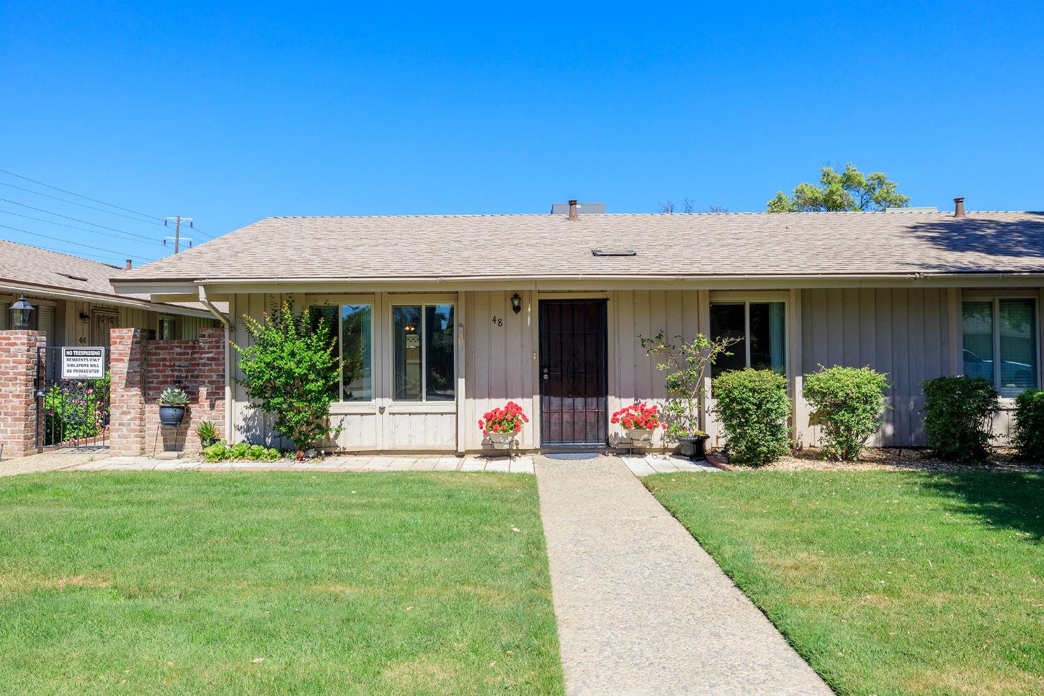 617 West Granger Avenue, Unit 48 Modesto, CA 95350 - Photo 1 of 27 front view of a house with a yard