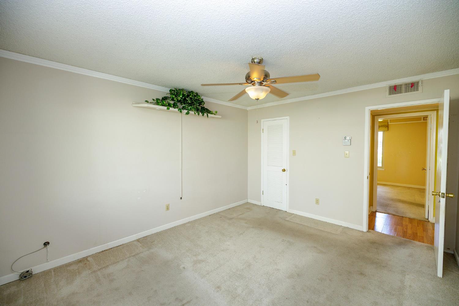 617 West Granger Avenue, Unit 48 Modesto, CA 95350 - Photo 14 of 27 an empty room with a potted plant
