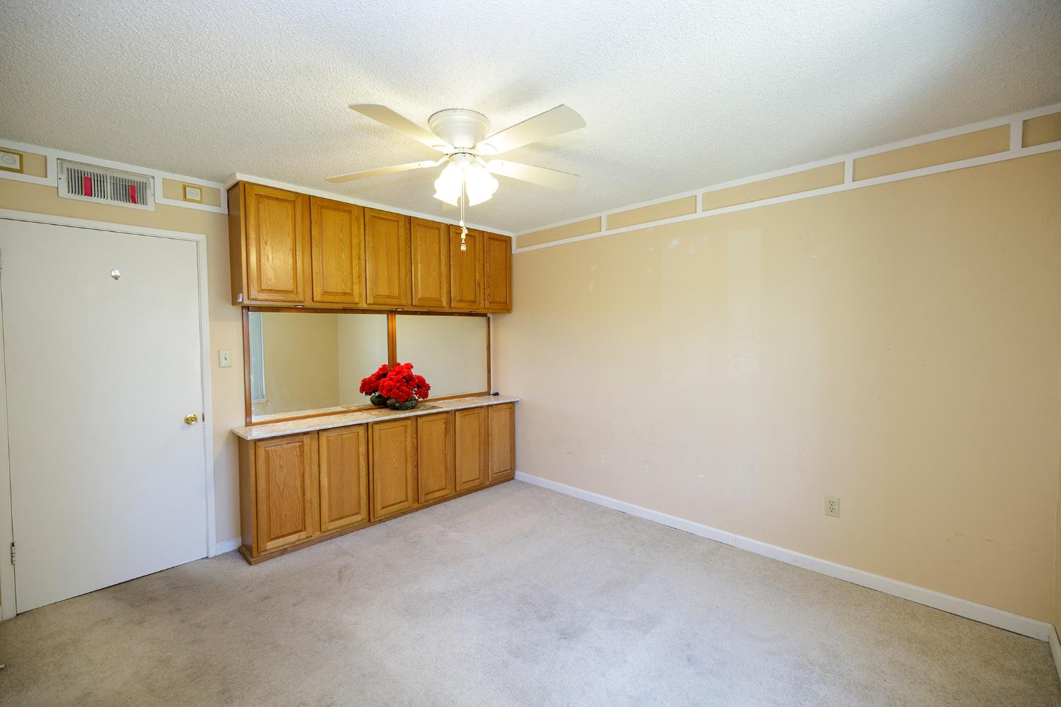 617 West Granger Avenue, Unit 48 Modesto, CA 95350 - Photo 19 of 27 a view of a room with wooden floor and fan