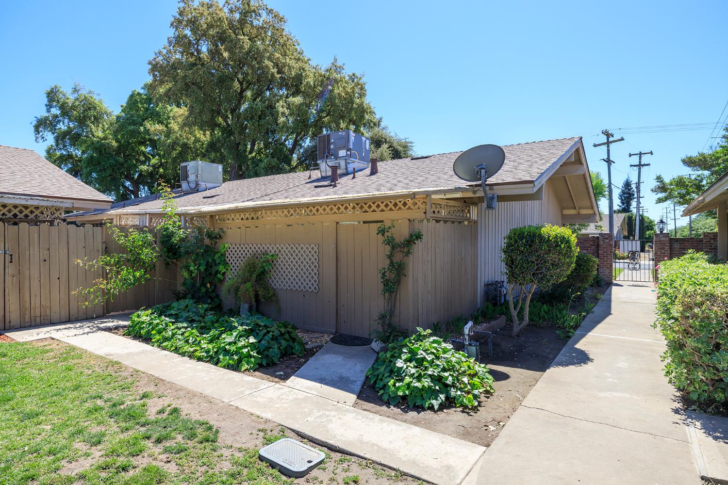 617 West Granger Avenue, Unit 48 Modesto, CA 95350 - Photo 24 of 27 a view of a house with potted plants