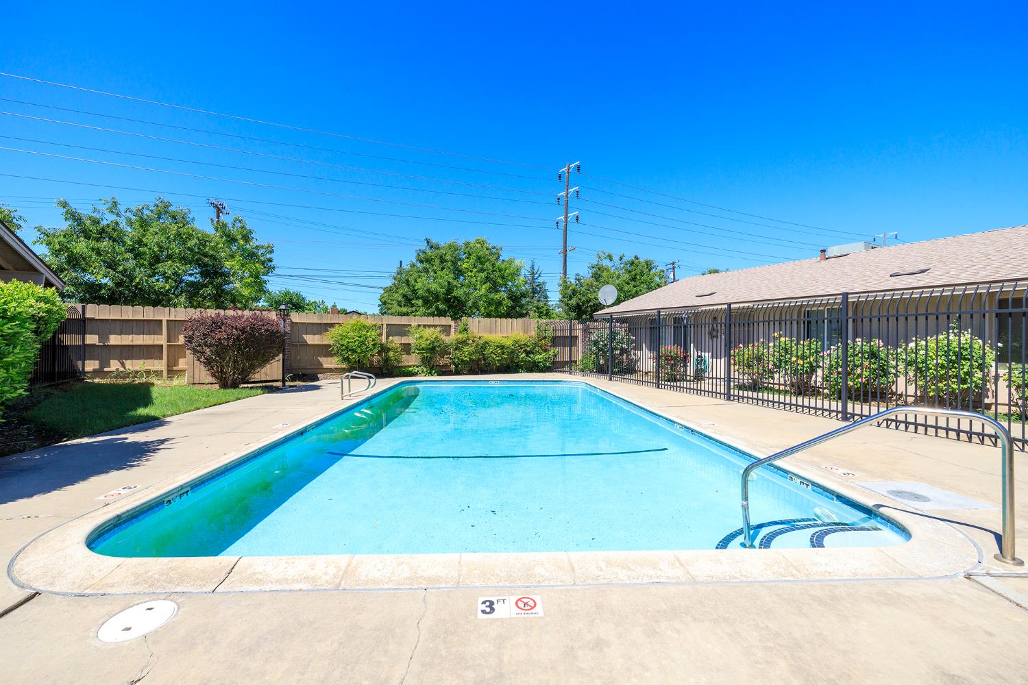 617 West Granger Avenue, Unit 48 Modesto, CA 95350 - Photo 25 of 27 a view of a swimming pool with a yard